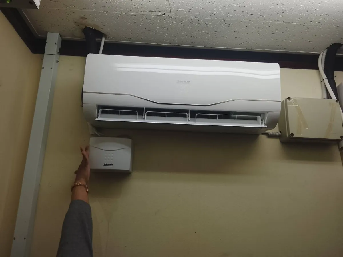 The same aircon closed up with a new condensate pump mounted below it