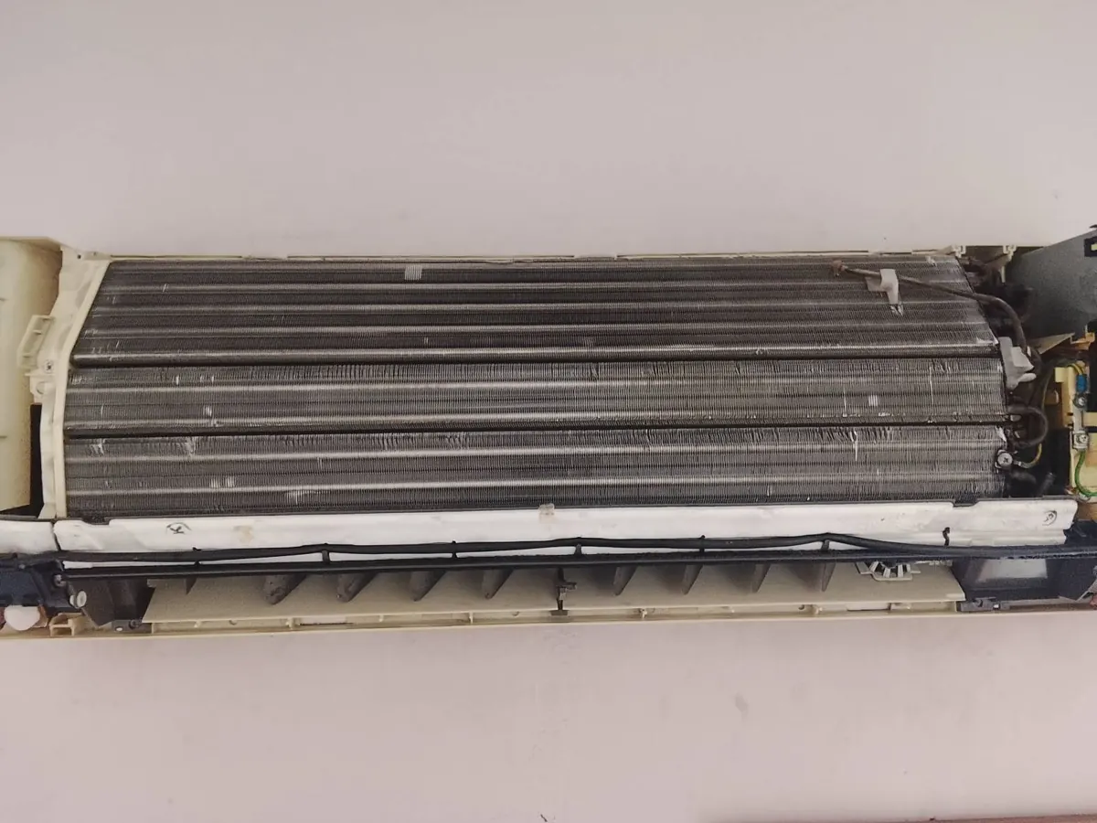 The same aircon coil after chemical cleaning, fins clean and visible
