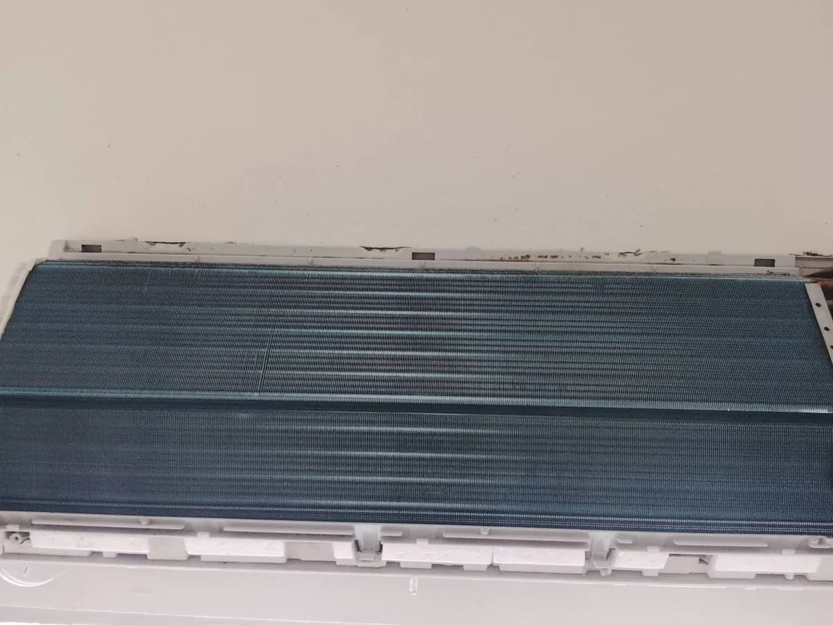 The same indoor coil after cleaning, blue coating clean